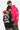 Sweat col rond Fifty Noir porté de dos, inscription blanche Eleven Paris No Snitch Lovers, à côté d'un sweat rose