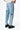 Pantalon Beleo Bleu Jean vu de dos et de côté, poche arrière et fleurs de lys noires sur denim délavé clair