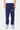 Jogging Foly Bleu Marine de face sur mannequin homme, inscription blanche Elevenparis sur la cuisse, baskets bleues