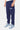 Jogging Foly Bleu Marine vu de dos sur mannequin homme, taille élastiquée et baskets bleu clair