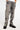 Pantalon Beleo Gris, plan rapproché de face sur les jambes, denim gris avec fleurs de lys noires et baskets noires