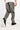 Pantalon Beleo Gris vu de dos en mouvement sur mannequin, pied levé, fleurs de lys noires sur denim gris