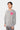 Pull col rond Edmo Gris porté de trois quarts par un mannequin homme, coupe ample, cœur rose smiley sur la poitrine