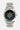 Montre Flappy Noir de face, bracelet acier, cadran noir avec fleur aux pétales multicolores et inscription ElevenParis