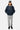 Blouson Eschott Bleu marine porté en pied par un mannequin homme avec casquette grise et pantalon cargo gris clair