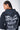 Sweat à capuche Evy Noir Délavé, zoom de dos sur le grand cœur gris et les inscriptions Love Amor blanches