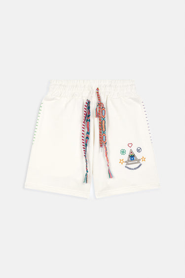 Short Maestro Écru de face à plat, cordon tressé multicolore et broderie colorée avec pyramide et étoiles