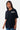 T-shirt Fabea Noir oversize porté de face par une mannequin femme, logo Eleven Paris blanc sur la poitrine