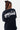 T-shirt Fabea Noir porté de dos par une mannequin femme, gros plan sur le logo Eleven Paris blanc et ses étoiles