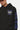 Sweat à capuche Fabian Noir, zoom sur le logo ELVN PRS bleu à cœur et étoile, cordons et manche ELVN