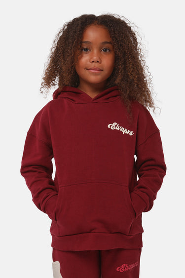 Sweat à capuche Falou Bordeaux porté par une fille, vue de face, broderie Eleven Paris sur la poitrine