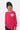 T-shirt Famour Rose à manches longues porté par un enfant, de face, cœur smiley écru sur la poitrine, bonnet noir