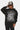 Sweat à capuche Fanta Noir porté par une femme avec casquette, motif toile d'araignée et inscription Eleven Paris