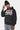 Sweat à capuche Faon Noir Délavé porté par un homme avec bonnet noir, trois oursons et inscription ELEVENPARIS, vue de face