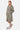 Sweat à capuche zippé Farell Kaki porté de trois quarts par une femme avec short Jiora assorti, fleurs de lys