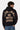 Sweat à capuche Fendy Noir porté par un homme, vue de dos, inscription beige ELEVENPARIS NO SNITCH LOVERS, jean bleu