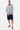 Sweat à capuche Fendy Gris Chiné porté en pied par un homme avec short cargo bleu marine et baskets roses