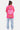 T-shirt Feremy Rose porté en pied par une femme, vue de dos, grand cœur ELEVENPARIS et inscription No Snitch Win Again