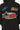 Sweat à capuche Ferrary Noir en gros plan de dos, étoile rouge et blanche NO SNITCH, damier bleu et logo ELVN