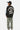 Sweat col rond Fifty Noir porté de dos par une mannequin, inscription Eleven Paris No Snitch Lovers blanche, jean camouflage
