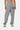 Jogging Filya Gris Chiné porté de face par une mannequin, logo Eleven Paris brodé et petits motifs sur les jambes, baskets