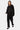 Jogging Futelia Noir clouté sur la jambe, porté en ensemble avec le sweat à capuche à flammes par une mannequin