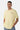 T-shirt Flaris Jaune porté de face par un mannequin homme, petite inscription beige l'amour win sur la poitrine, jean