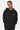Sweat à capuche Flocon Noir porté de face par une mannequin femme, mains en poches, petit cœur blanc sur la poitrine