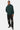 Sweat à capuche Flocon Vert porté en ensemble avec un jogging noir par un mannequin homme, petit cœur blanc sur la poitrine