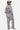 Sweat col rond Flora Gris Chiné porté de dos par une mannequin avec casquette, broderie Eleven Paris Therapy, jogging gris