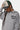 Sweat col rond Flora Gris Chiné, zoom sur la broderie cursive Eleven Paris et petites fleurs sur la poitrine, casquette