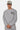 Sweat col rond Flora Gris Chiné porté de face par un mannequin homme avec casquette, broderie cursive Eleven Paris