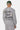 Sweat col rond Flora Gris Chiné porté de dos par un mannequin homme, broderie cursive Eleven Paris Therapy Reset button
