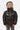 Doudoune enfant Flash Noir brillante portée de face, capuche, zip et petit coeur brodé blanc sur la poitrine