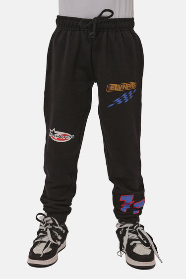 Jogging enfant French Noir de face, cordon de serrage, écussons de course rouge, orange et bleu sur la jambe