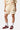Short en maille Jabba Écru porté par une mannequin femme, cœurs et étoile brodés, chaussettes blanches