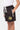 Short enfant Jabali Noir vu de côté, zip blanc sur la poche et logo rond doré sur la cuisse