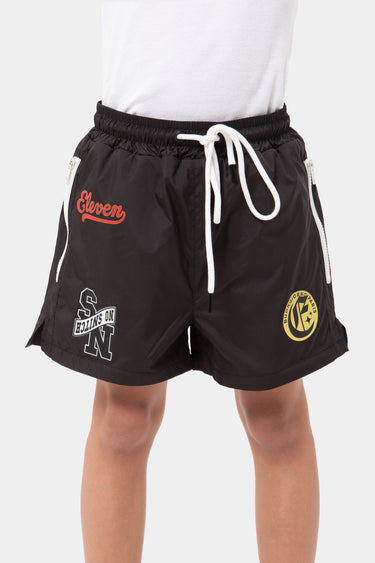 Short enfant Jabali Noir de face, cordon blanc, inscription Eleven rouge et écussons SN et doré