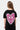 Robe enfant Jacky Noir vue de dos, grand cœur en mosaïque rose et blanche avec inscription No Snitch