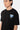T-shirt Jais Noir en gros plan sur un mannequin homme, petit cœur bleu Eleven Paris et chaîne argentée