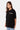 T-shirt Jamaica Noir porté par une mannequin femme, de trois quarts, inscription Elevenparis blanche sur la poitrine