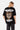 T-shirt Janiel Noir vu de dos sur une mannequin femme, cœur zébré brun, textes blancs et jean gris à fleur de lys