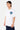 T-shirt Janiel Blanc porté de trois quarts par un mannequin homme, petit cœur zébré bleu et vert sur la poitrine