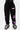 Jogging Jazzy Noir porté par un enfant, de face, étoiles violettes sur la jambe et inscription violette sur la cuisse