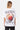 T-shirt Jegg Blanc oversize porté par une mannequin femme, vue de dos, coeur oeuf au plat et adresse Eleven Records