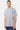 T-shirt Jelly Gris Chiné porté par un mannequin homme, de face, petit coeur bleu qui coule sur la poitrine