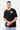 T-shirt Jentin Noir porté par un mannequin homme, de face, collier chaîne, inscription crème l'amour win et jean clair