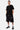 T-shirt Jerusalema Noir porté avec un short noir Eleven Paris, mannequin homme en pied de face, baskets noires