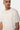 T-shirt Jerusalema Écru porté par un mannequin homme, gros plan de face, coeur écru en relief, collier chaîne
