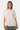 T-shirt Jerusalema Écru oversize porté par une mannequin femme, de face, coeur en relief, short kaki Eleven